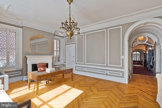 office area featuring parquet floors, an inviting chandelier, and crown molding