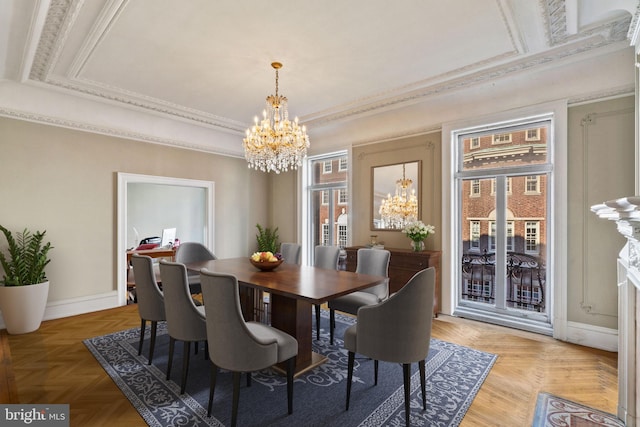 dining room featuring crown molding, light parquet floors, and an inviting chandelier