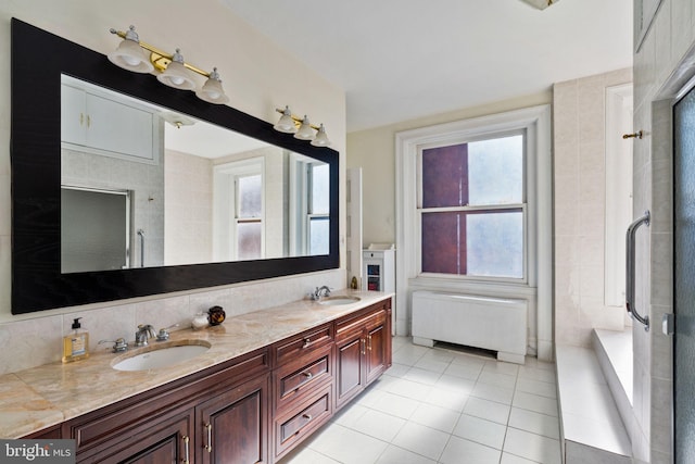 bathroom featuring walk in shower, tile patterned floors, vanity, and plenty of natural light