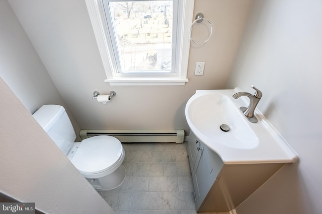 bathroom with vanity, toilet, and a baseboard radiator