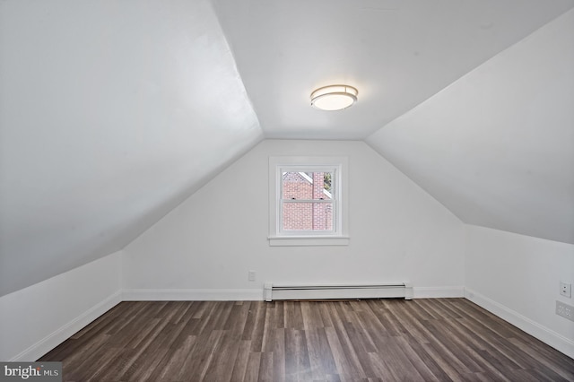 bonus room featuring lofted ceiling, a baseboard heating unit, and dark hardwood / wood-style flooring