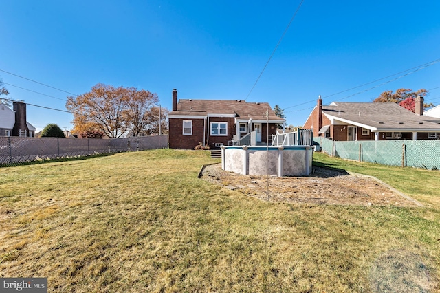 view of yard featuring a fenced in pool