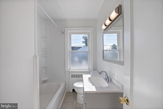 full bathroom with tiled shower / bath, radiator heating unit, toilet, vanity, and tile patterned floors