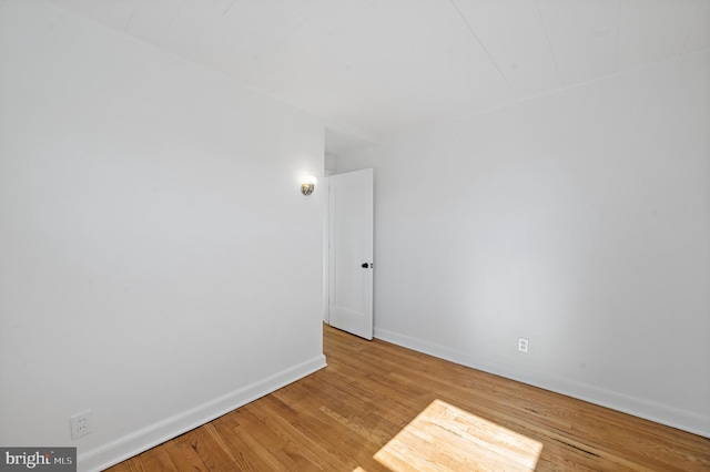 spare room with light hardwood / wood-style floors