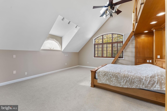 bedroom with lofted ceiling, light colored carpet, and ceiling fan