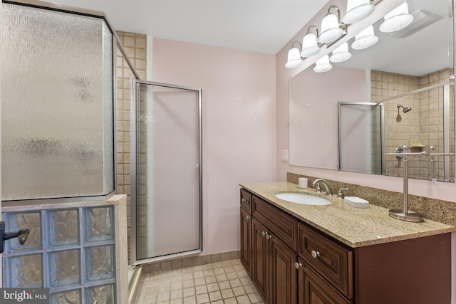 bathroom with vanity and walk in shower