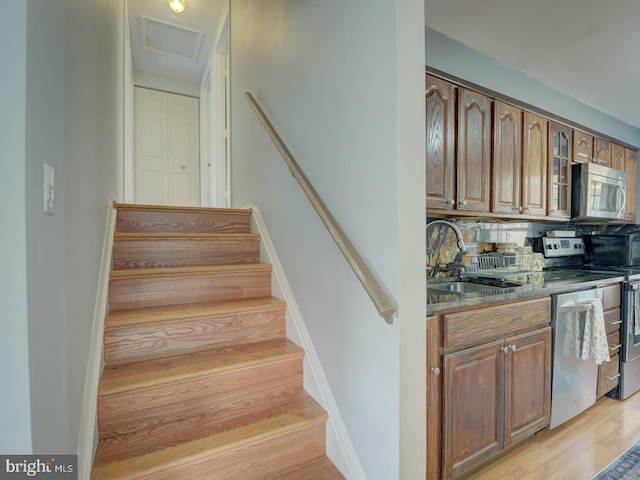 9321 Linhurst Dr, Clinton, MD 20735 - stairs featuring wood finished floors and attic access