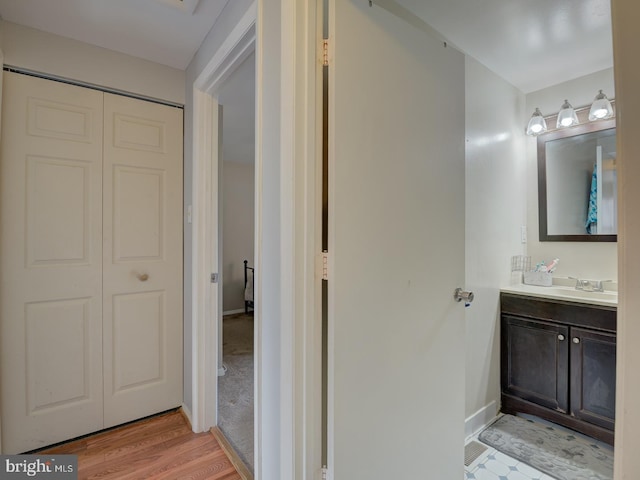 9321 Linhurst Dr, Clinton, MD 20735 - bathroom with vanity, baseboards, and wood finished floors