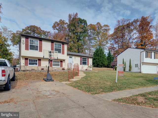 view of front of home featuring a garage and a front yard