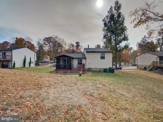9321 Linhurst Dr, Clinton, MD 20735 - back of house featuring a sunroom, a wooden deck, and a yard