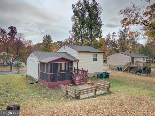 9321 Linhurst Dr, Clinton, MD 20735 - rear view of property featuring a sunroom, a wooden deck, and a lawn