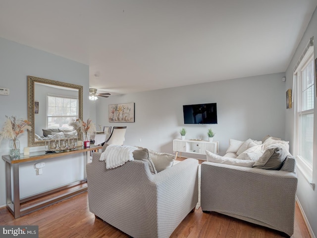 9321 Linhurst Dr, Clinton, MD 20735 - living room featuring healthy amount of natural light, wood finished floors, and ceiling fan
