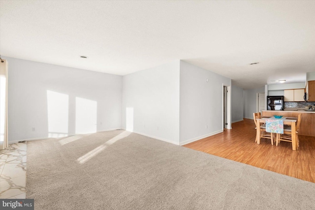 spare room with light hardwood / wood-style floors