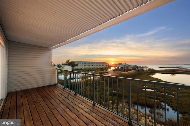 balcony at dusk with a water view