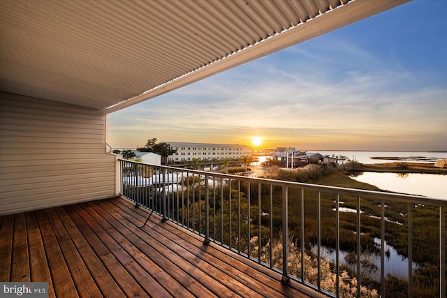 balcony at dusk with a water view