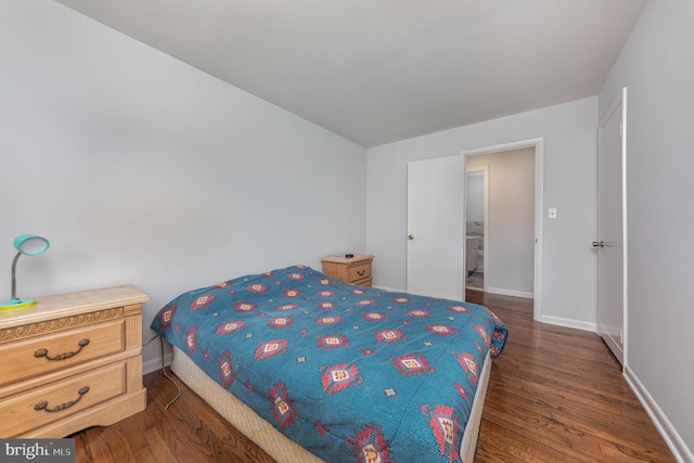 bedroom featuring dark hardwood / wood-style flooring