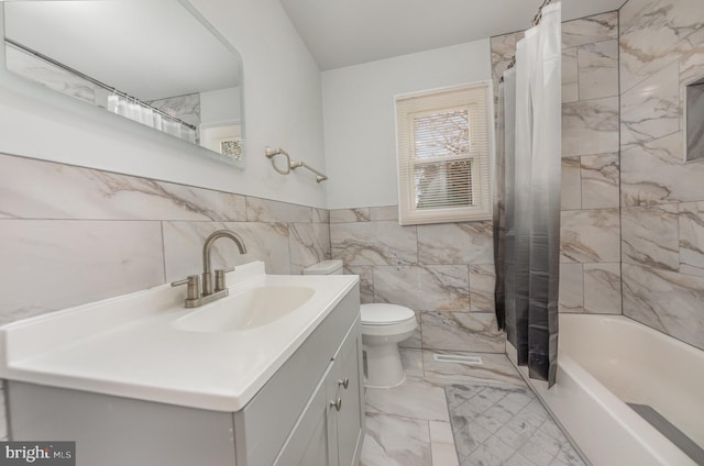 full bathroom with vanity, shower / bath combination with curtain, tile walls, and toilet