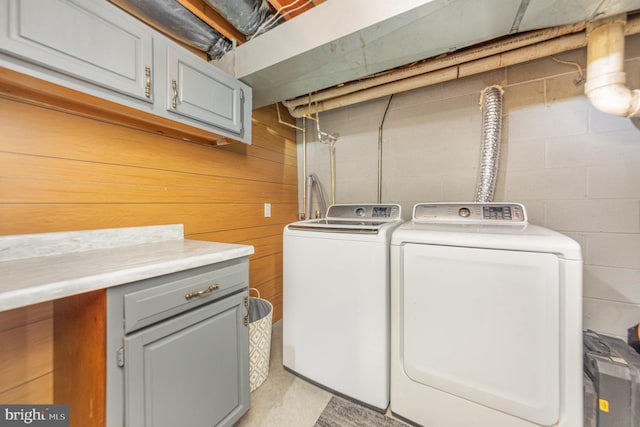 laundry area featuring cabinets and washer and dryer