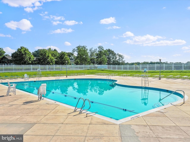 view of swimming pool with a patio