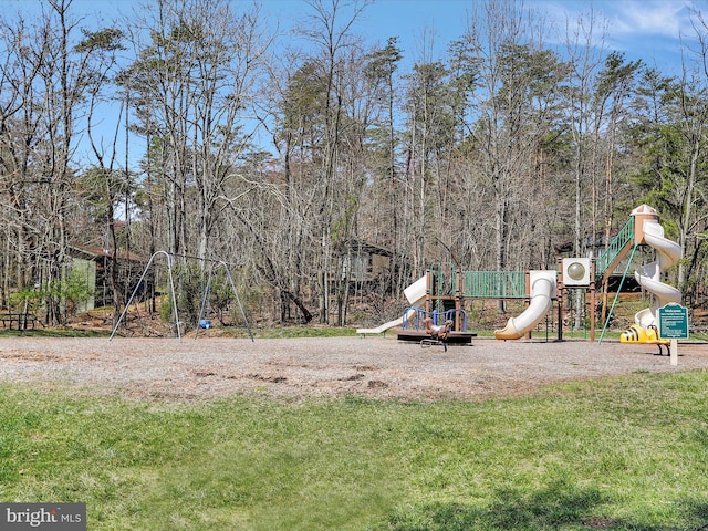 view of jungle gym with a lawn