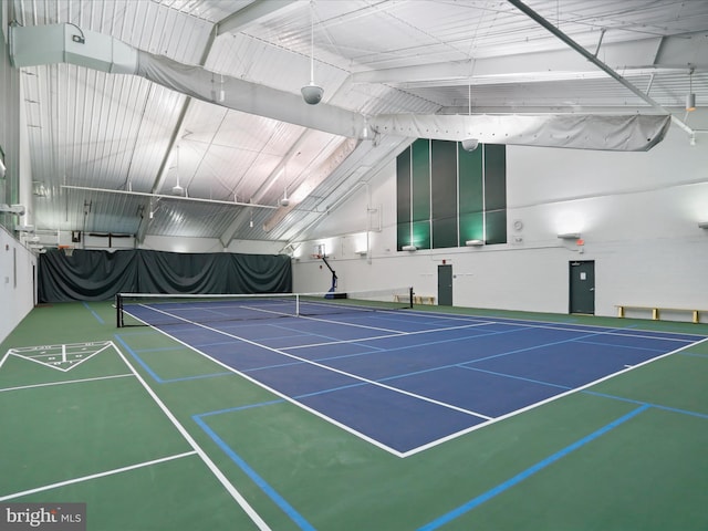 view of tennis court featuring basketball hoop