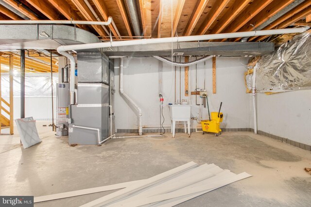 basement with water heater, sink, and heating unit