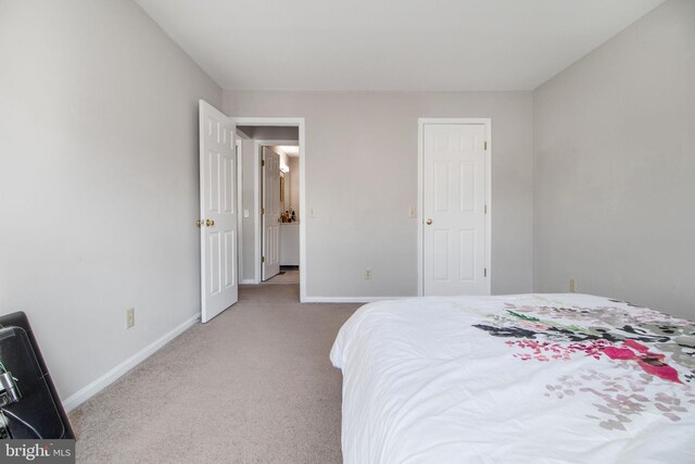 bedroom with light carpet