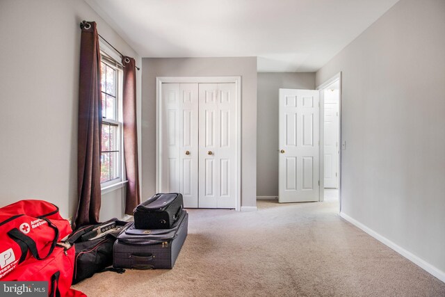 carpeted bedroom with a closet