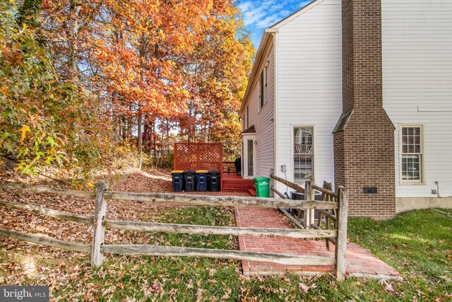 view of property exterior featuring a deck