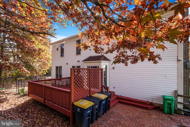 rear view of property with a wooden deck