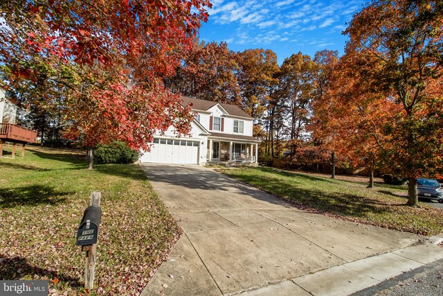 view of front facade featuring a garage and a front lawn