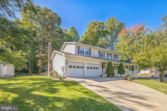 view of front of home with a porch, a front lawn, and a garage