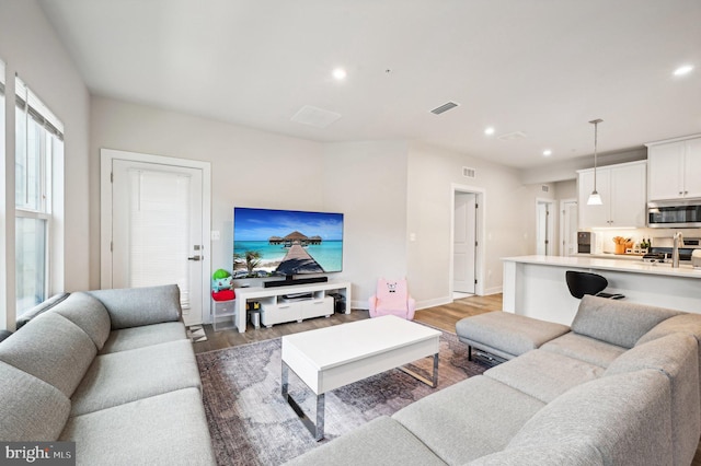 living room with light hardwood / wood-style floors