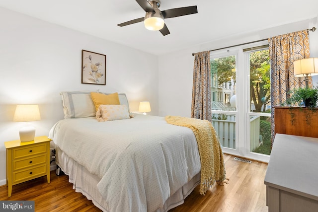 bedroom with hardwood / wood-style floors and ceiling fan