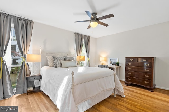 bedroom featuring light hardwood / wood-style floors and ceiling fan