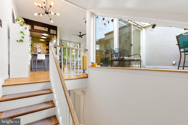 staircase with ceiling fan