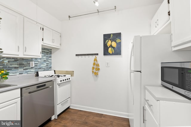 kitchen featuring white cabinetry, stainless steel appliances, backsplash, and dark hardwood / wood-style flooring