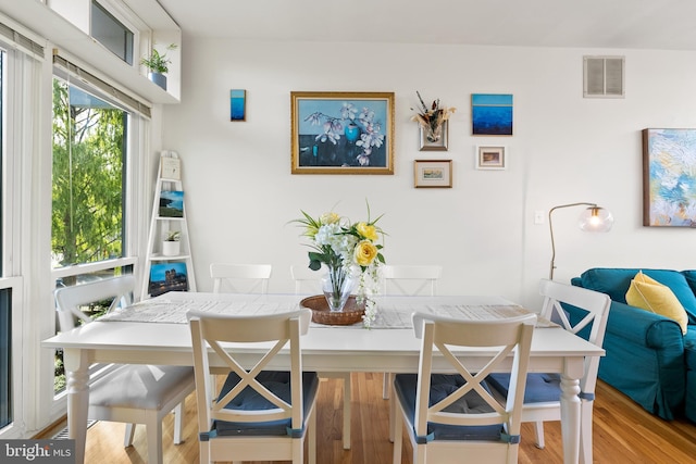 dining area with light hardwood / wood-style floors