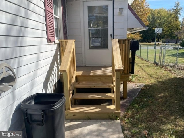 exterior space with a lawn and a wooden deck