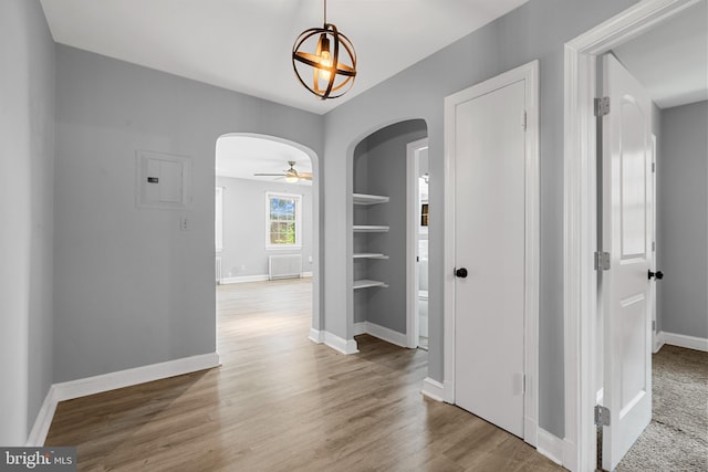 hall featuring hardwood / wood-style floors and radiator