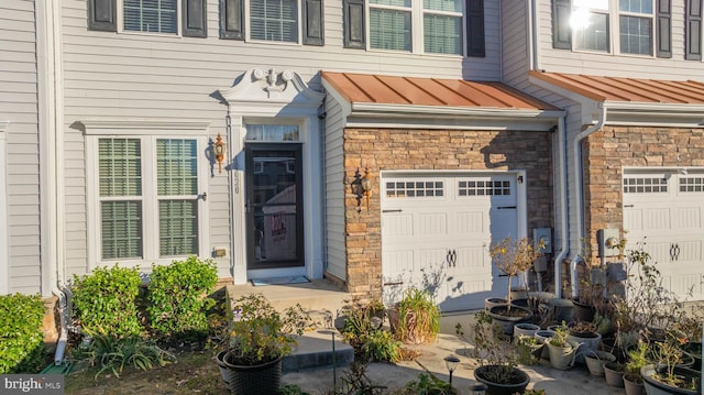 doorway to property featuring a garage