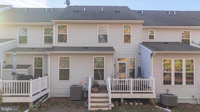 back of property featuring a deck and central AC unit