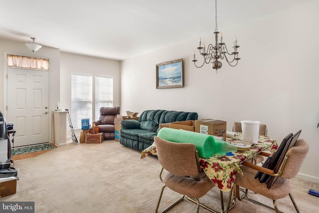 carpeted dining area featuring a notable chandelier