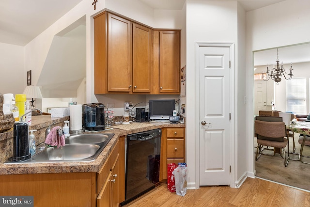 kitchen featuring black dishwasher, light hardwood / wood-style flooring, a notable chandelier, and sink