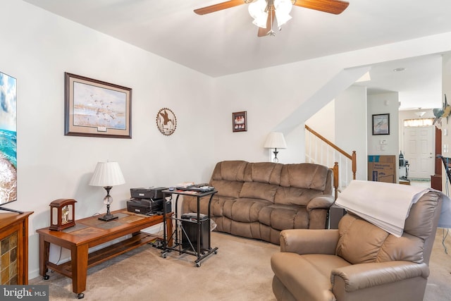 living room featuring light carpet and ceiling fan