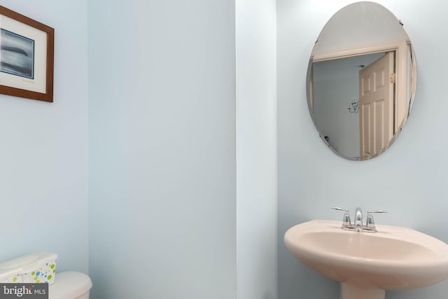 bathroom featuring sink and toilet