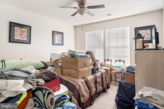 bedroom with ceiling fan and light colored carpet