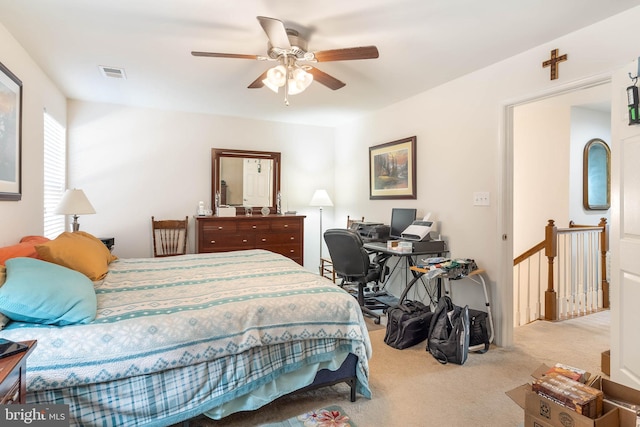 bedroom with light carpet and ceiling fan