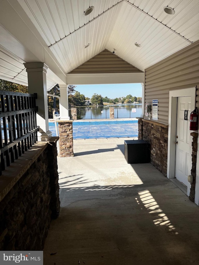 view of patio featuring a water view