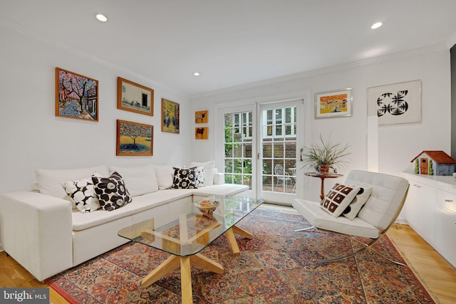 living room featuring crown molding and light wood-type flooring